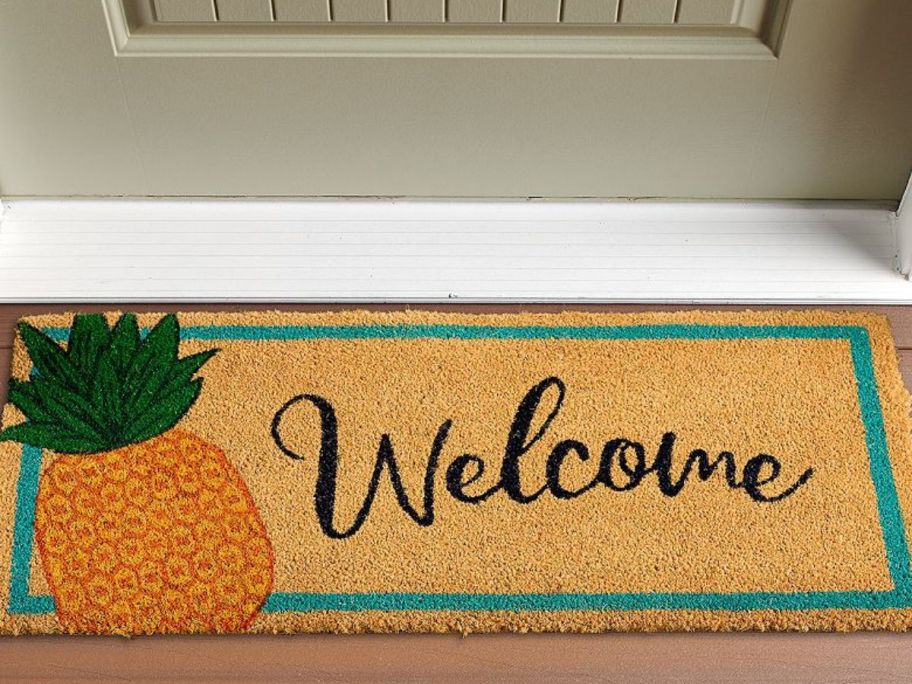A coir welcome mat with a pineapple on it