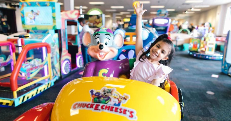 Little Girl on a mechanical ride at Chuck E. Cheese
