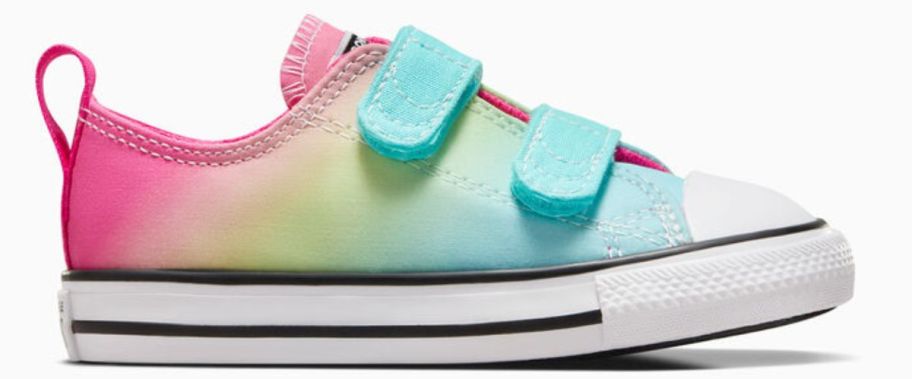 an ombre colored kids velcro sneaker