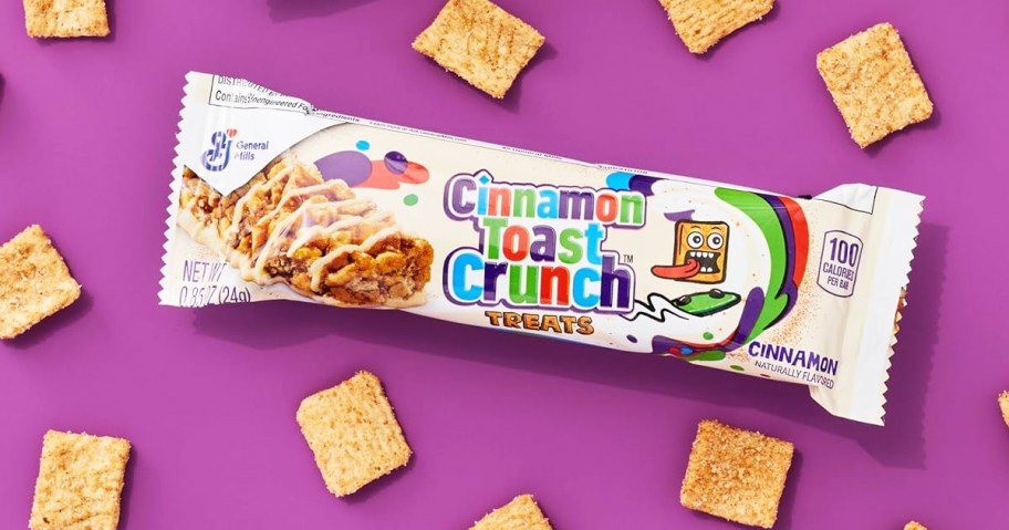 Cinnamon Toast Crunch breakfast bar surrounded by Cinnamon Toast Crunch cereal pieces