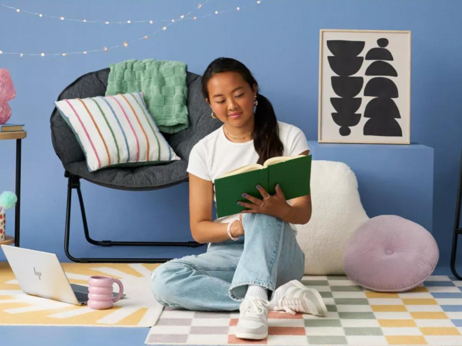 College Student in a Dorm reading a book