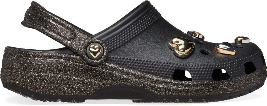 black glittery crocs clog with gold heart charms