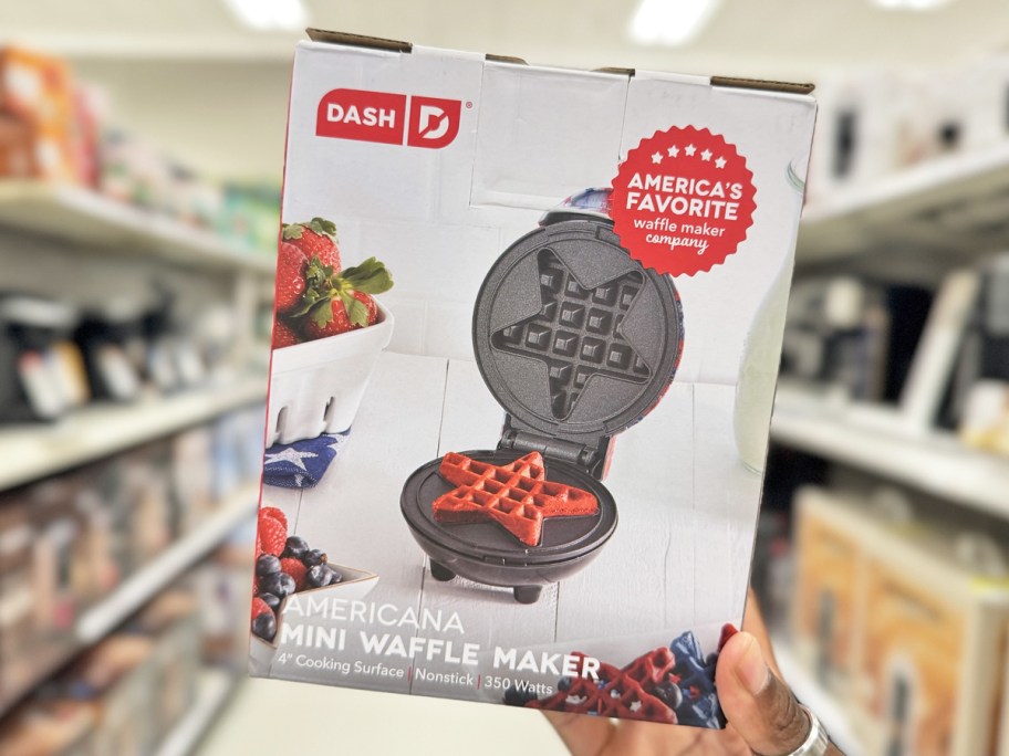 hand holding up a star shaped mini waffle maker box in store