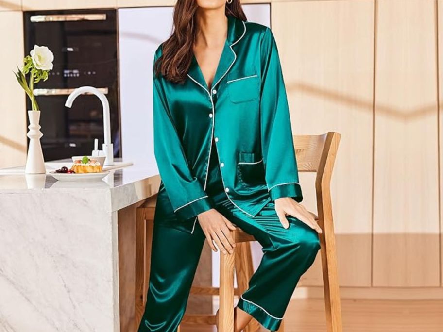 Woman sitting on a chair wearing long silk pajamas