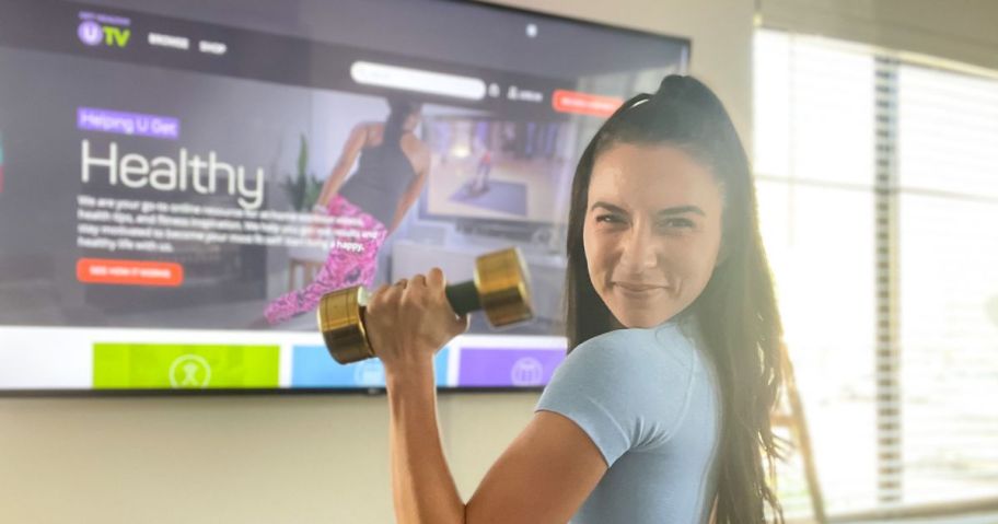 Get Healthy U TV streaming on a tv with a woman holding a small weight