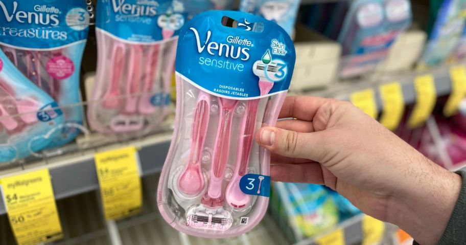Gillette Venus Sensitive Disposable Razors 3-Pack package being held by hand in store
