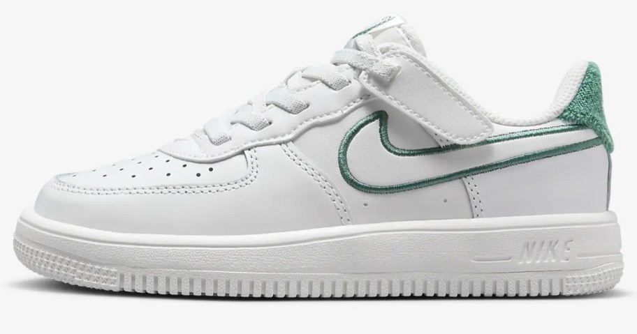 kid's Nike Force 1 shoes in white with a green swoosh