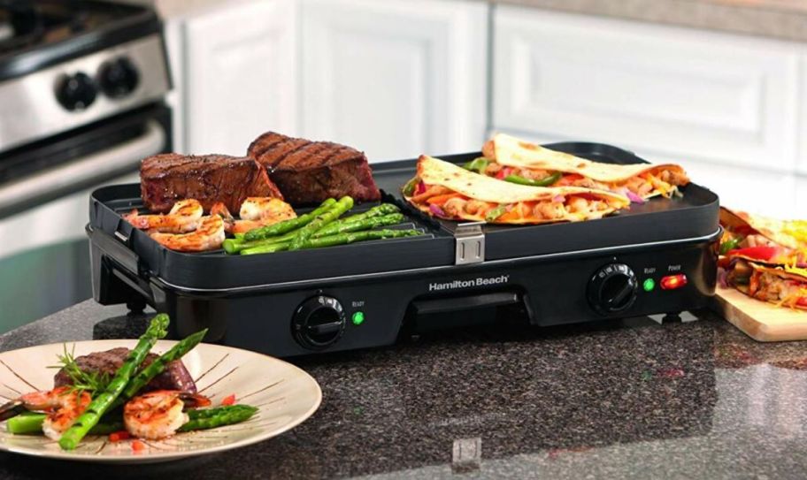a 3 in 1 griddle on a kitchen counter shown with foods for a steak sandwich