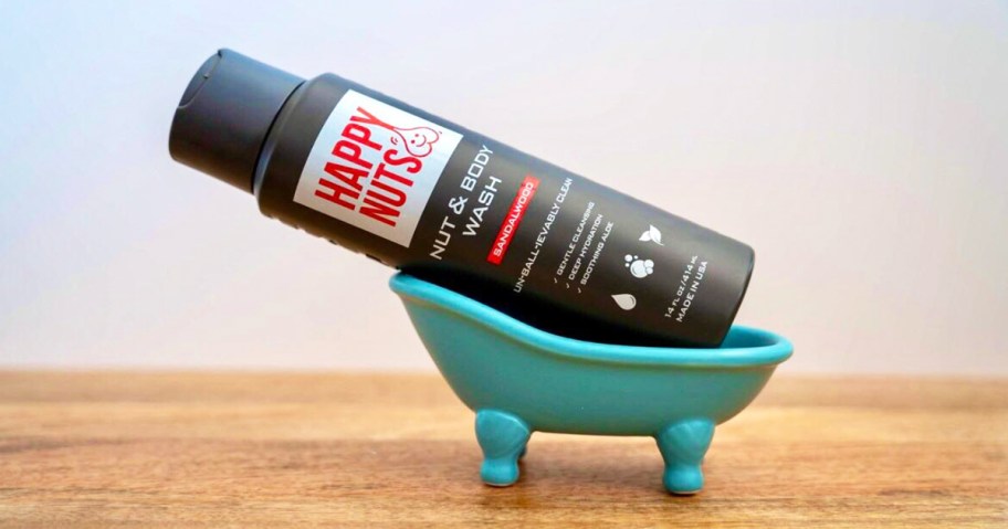 Happy Nuts Body Wash bottle in small plastic bathtub