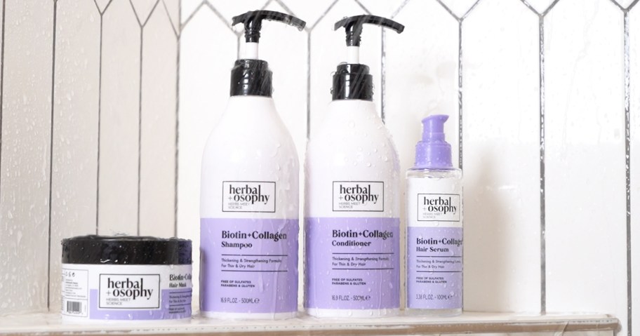 white and purple bottles of Herbalosophy Biotin + Collagen Shampoo & Conditioner in shower