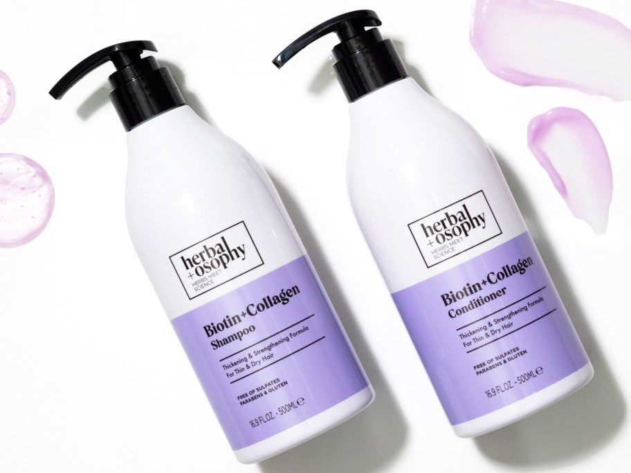 white and purple bottles of Herbalosophy Biotin + Collagen Shampoo & Conditioner
