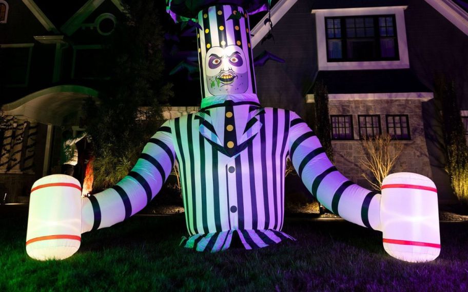 scary animatronic beetlegeuse ground breaker in front of a house