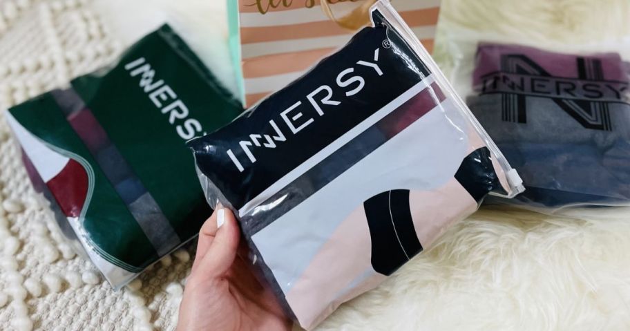 Hand holding a pack of Innersy Women's Underwear