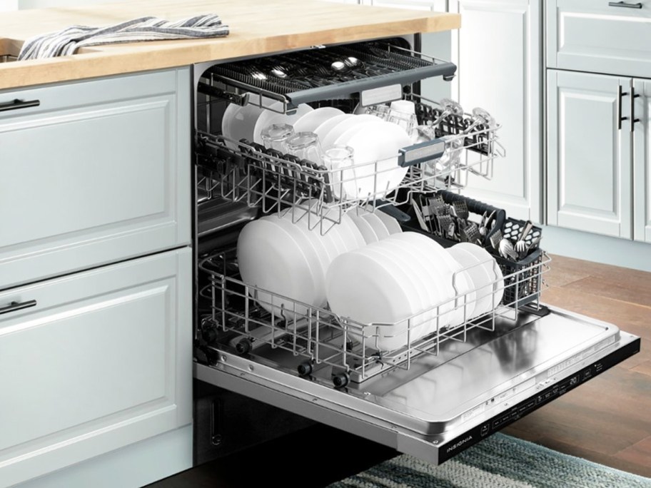 opened dishwasher with 3 racks of dishes
