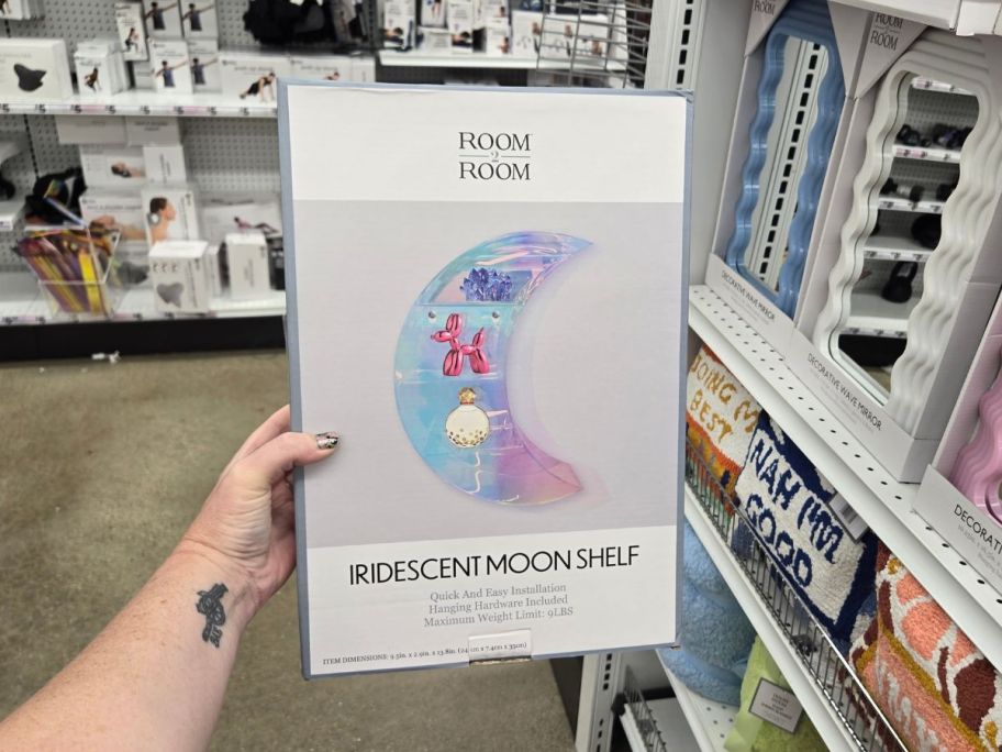 Iridescent Moon Shelf 9.5in x 13.8in box being held by hand in store
