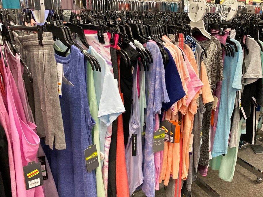 rack of womens tops with clearance tags in kohls store