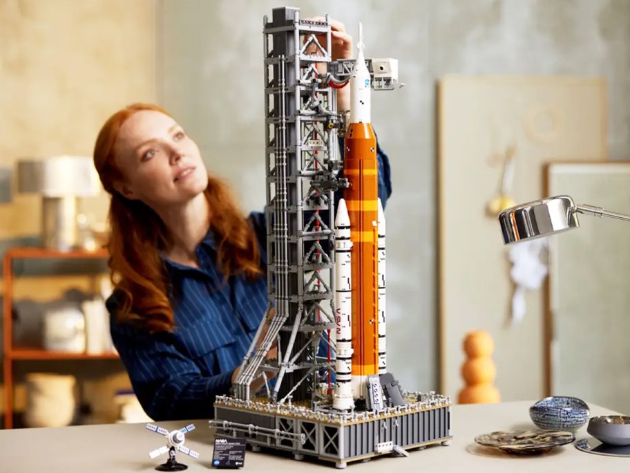 woman building LEGO NASA Artemis Space Launch System