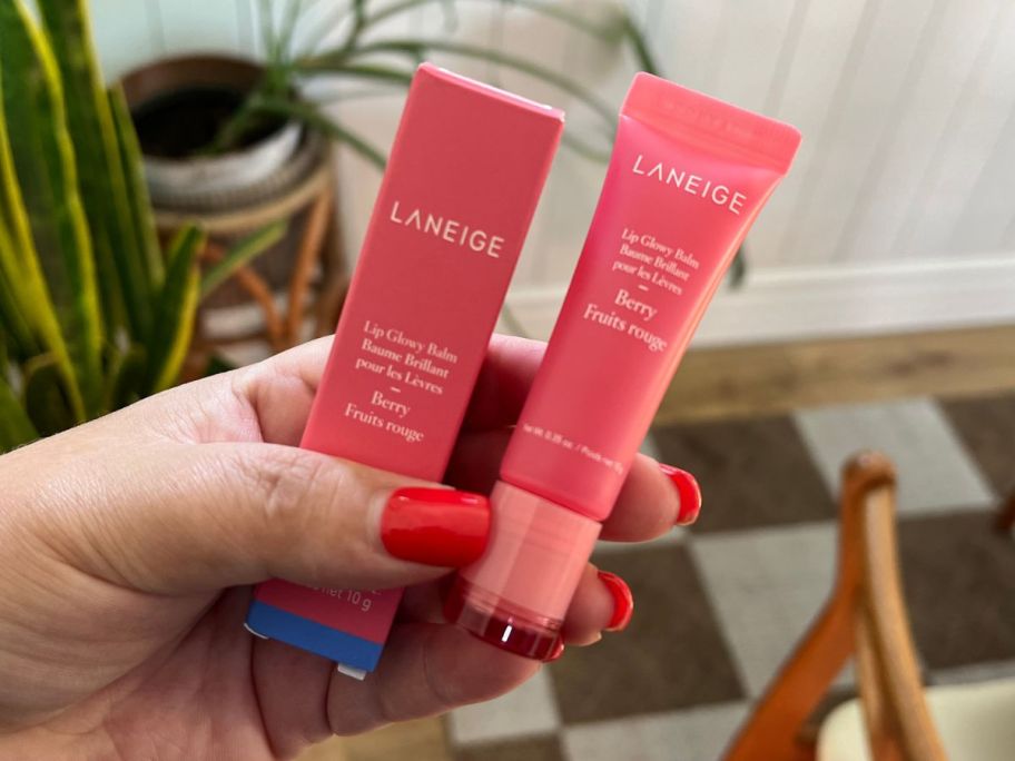 Laneige Lip Glowy Balm box and tube being held in hand
