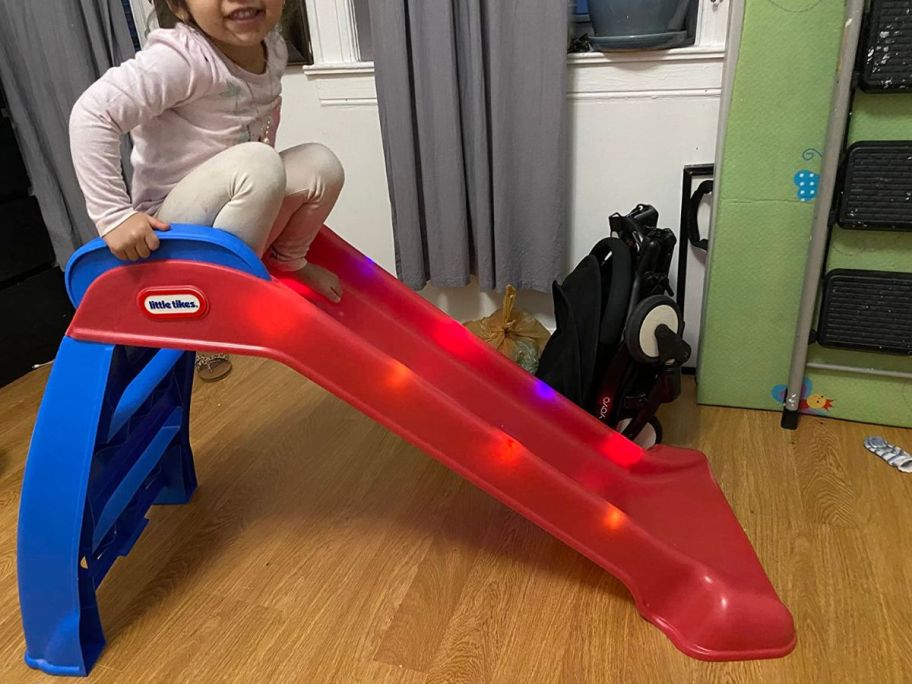 A child playing on a Little Tikes Light-Up Slide