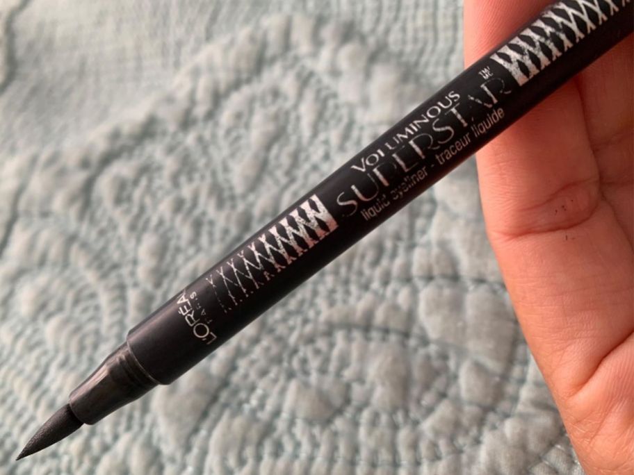 Hand holding a L'Oreal Eyeliner
