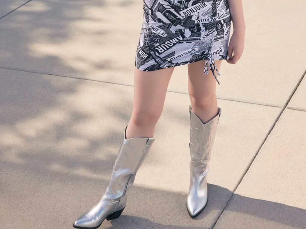 girl wearing silver cowboy boots