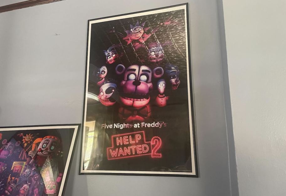 five nights of freddy poster hanging on wall with black frame