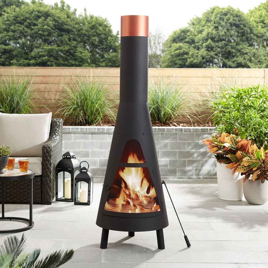 a black chiminea on a patio