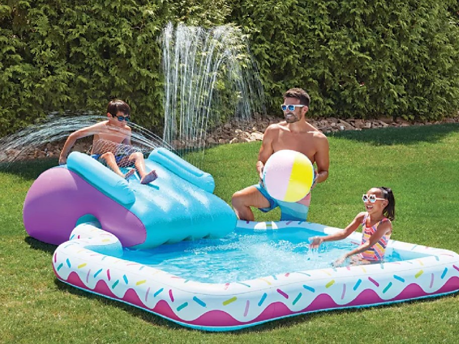 Member's Mark Novelty Pool with kid splaying on it