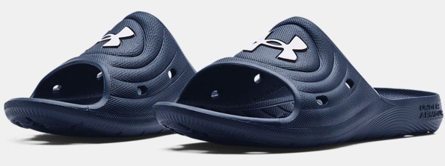 a pair of navy mens under armour slides