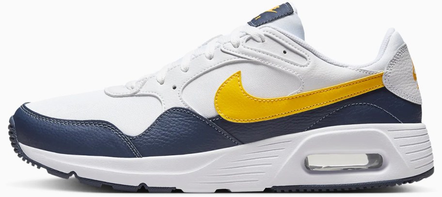 white, navy blue, and yellow nike sneaker