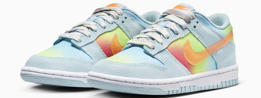 light blue nike sneakers with rainbow coloring on sides