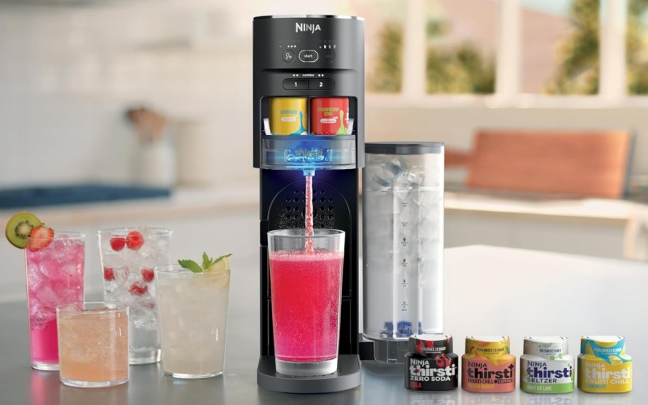 ninja thirsti drink system on counter with cups and water drop packs