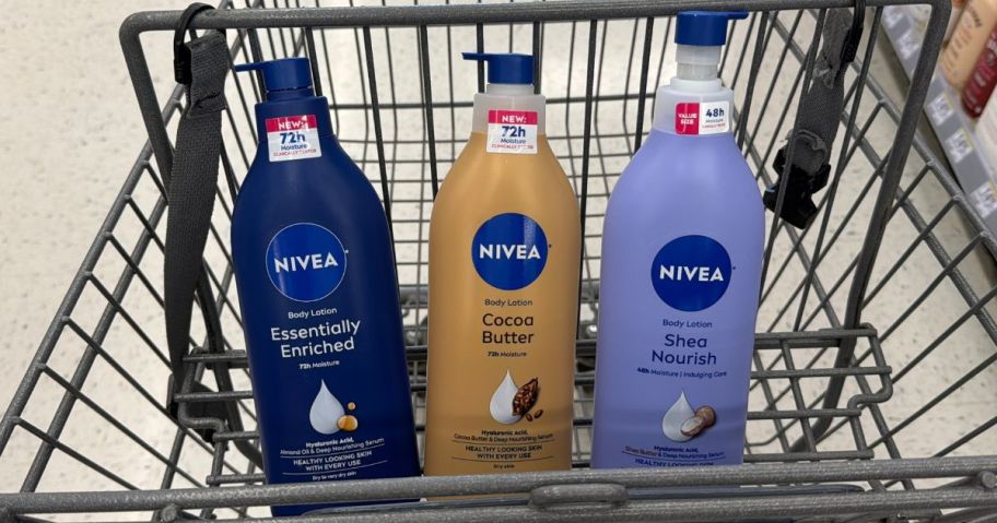 3 different bottles of Nivea Body Lotion in the front basket of a Walgreens shopping cart 