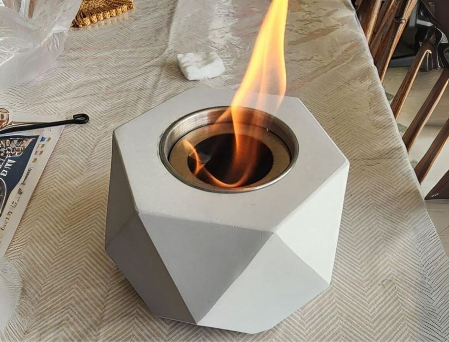 a lit mini tabletop fire pit