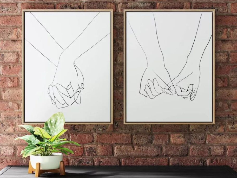 Project 62 Hands Canvases Target hanging on a brick wall