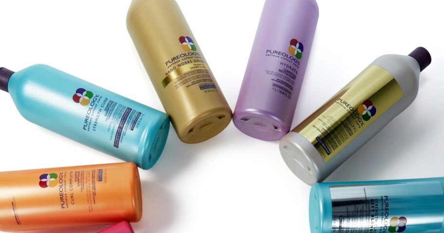 large bottles of Pureology shampoo & conditioner in a circle