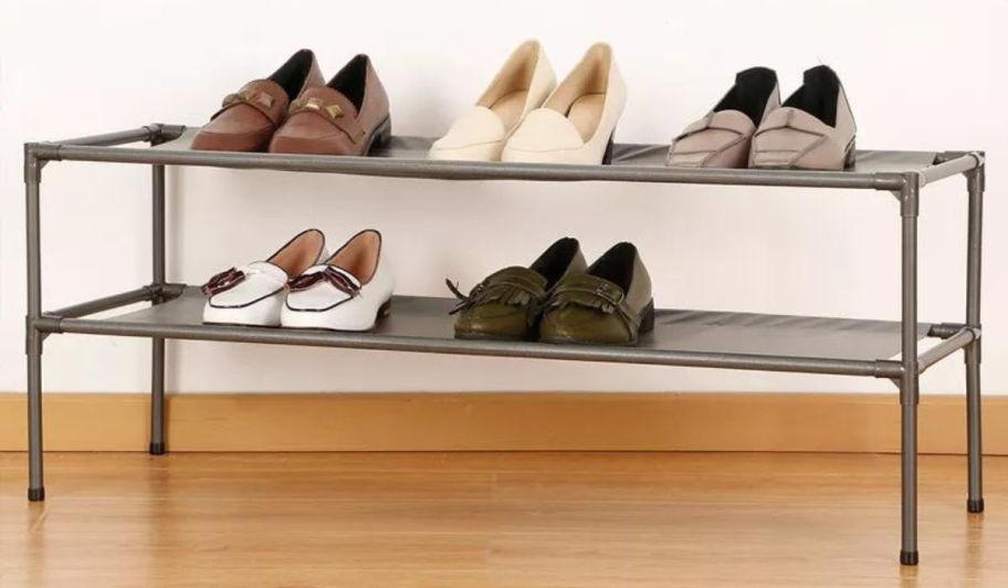 Several shoes on a Room Essentials 2-Tier Fabric Shoe Rack