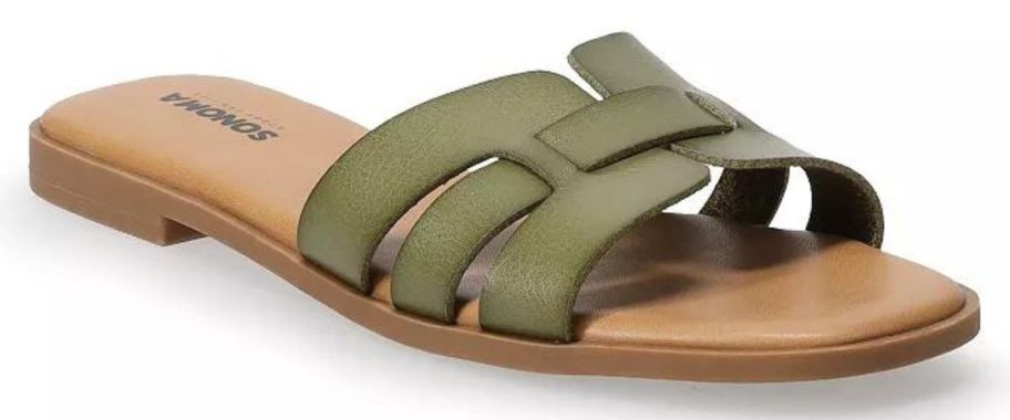 A pair of green and tan leather sandals