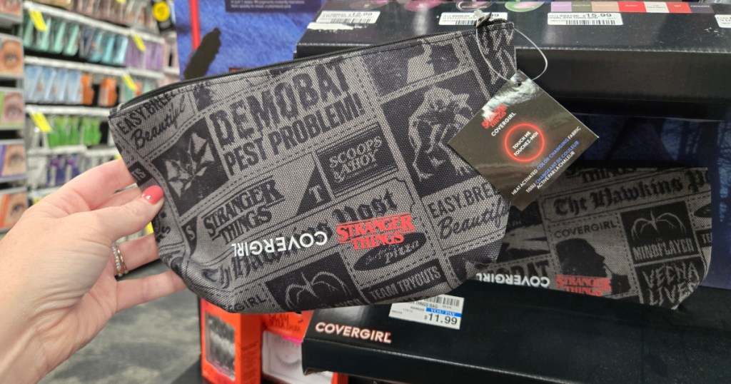 woman holding up Stranger Things make up bag