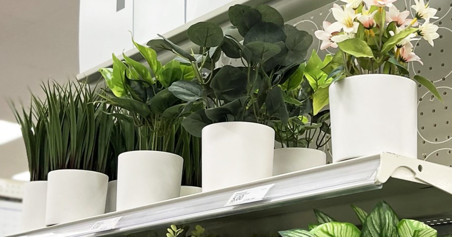 potted artificial plants on shelf at target