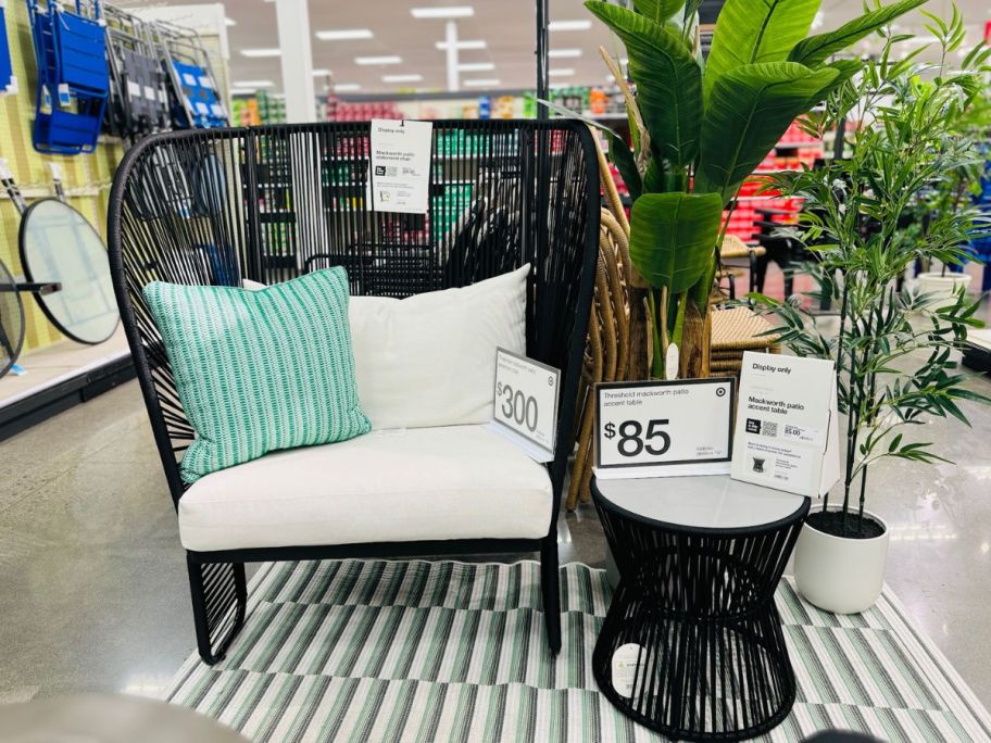 A high-backed patio bench and side table in Target