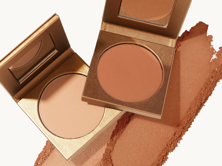 two opened tarte bronzers with swatches of each