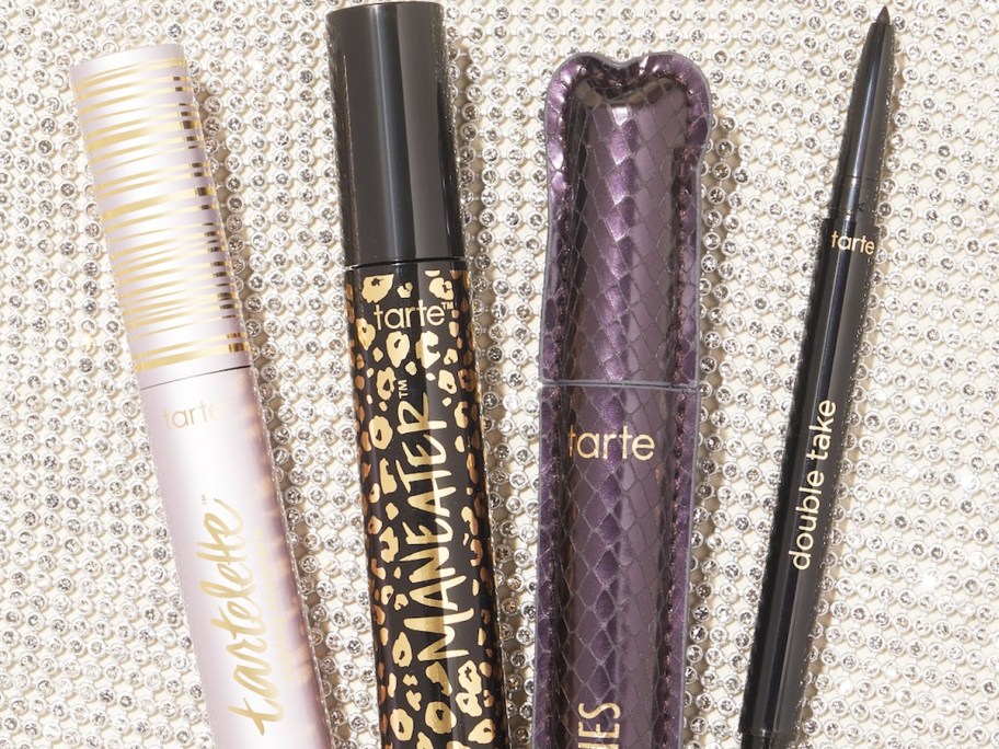 Tarte eyeliners and mascaras on a glittery background