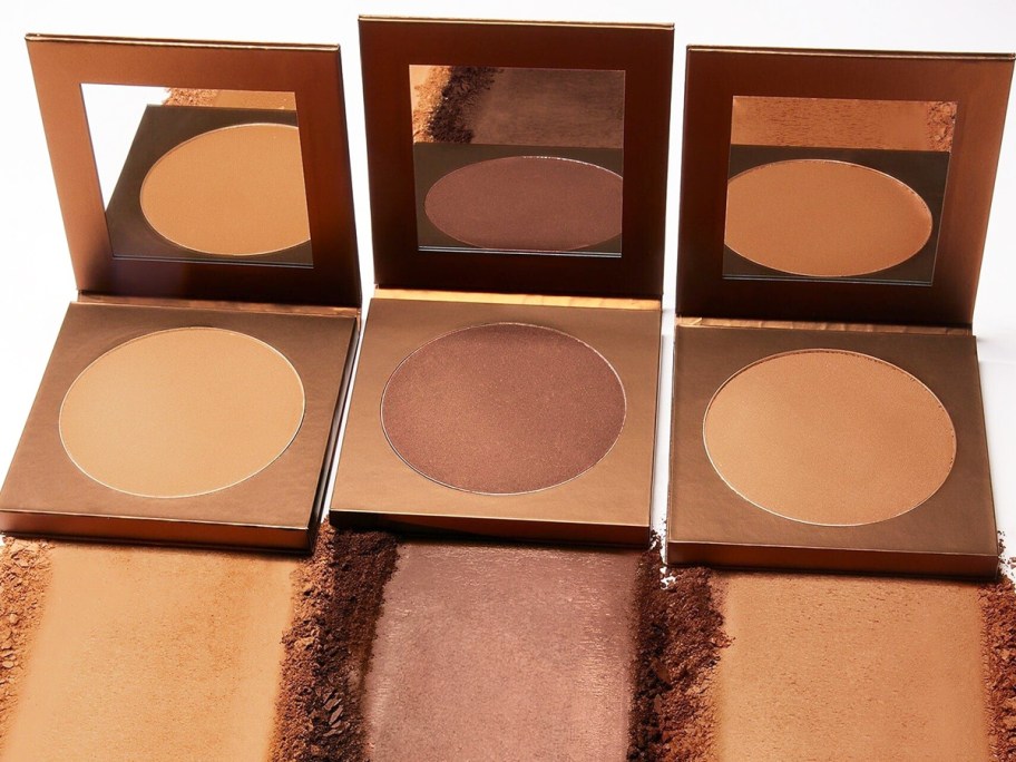 three shades of tarte bronzers with swatches of each