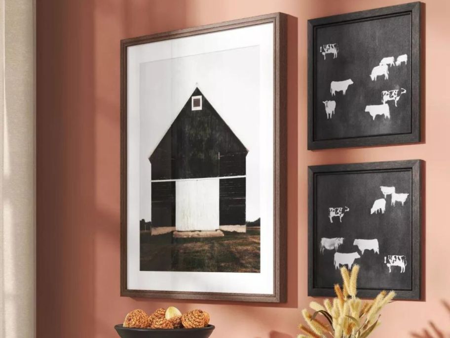 Threshold Framed Barn Poster hanging on a wall next to two square pictures with cows on them