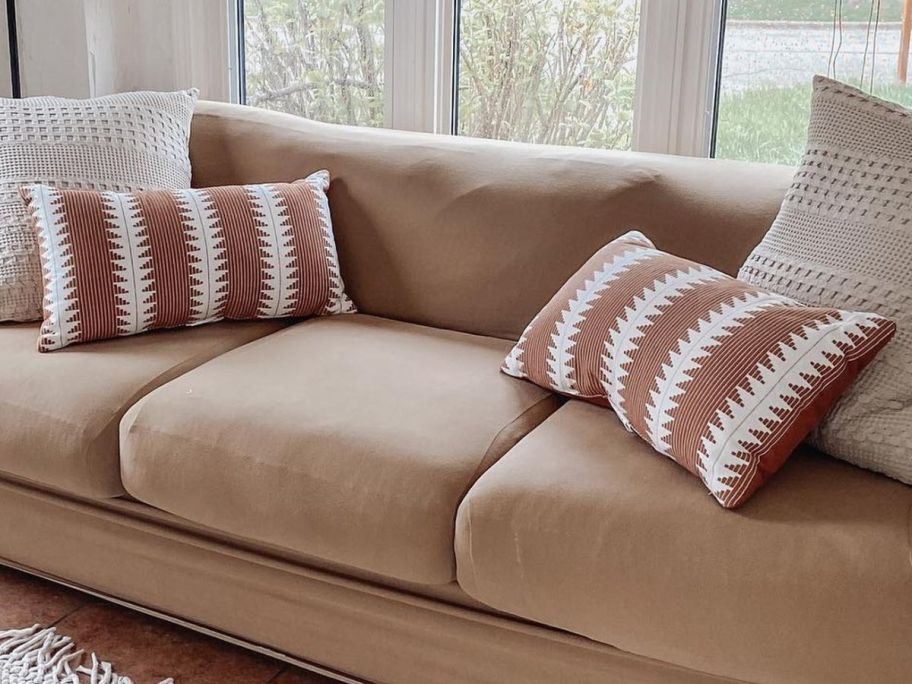 Threshold Oversize Lumbar Woven Global Pillows on a couch