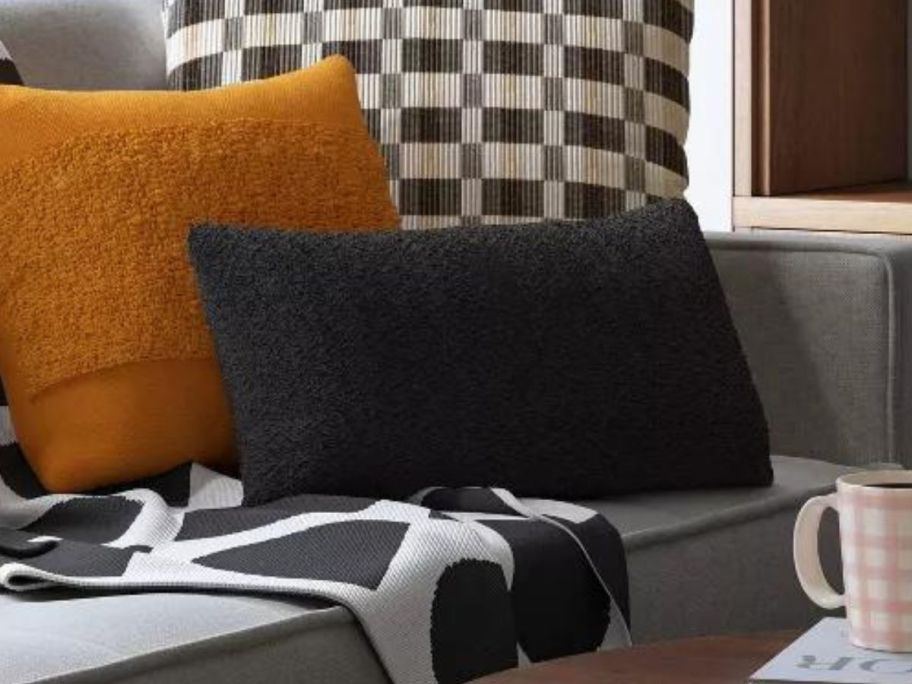 Two throw pillows on a couch 