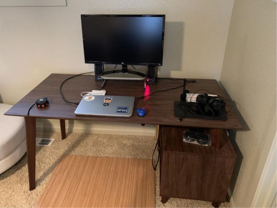 Union & Scale™ MidMod 60"W Computer and Writing Storage Desk with monitor and office supplies on top
