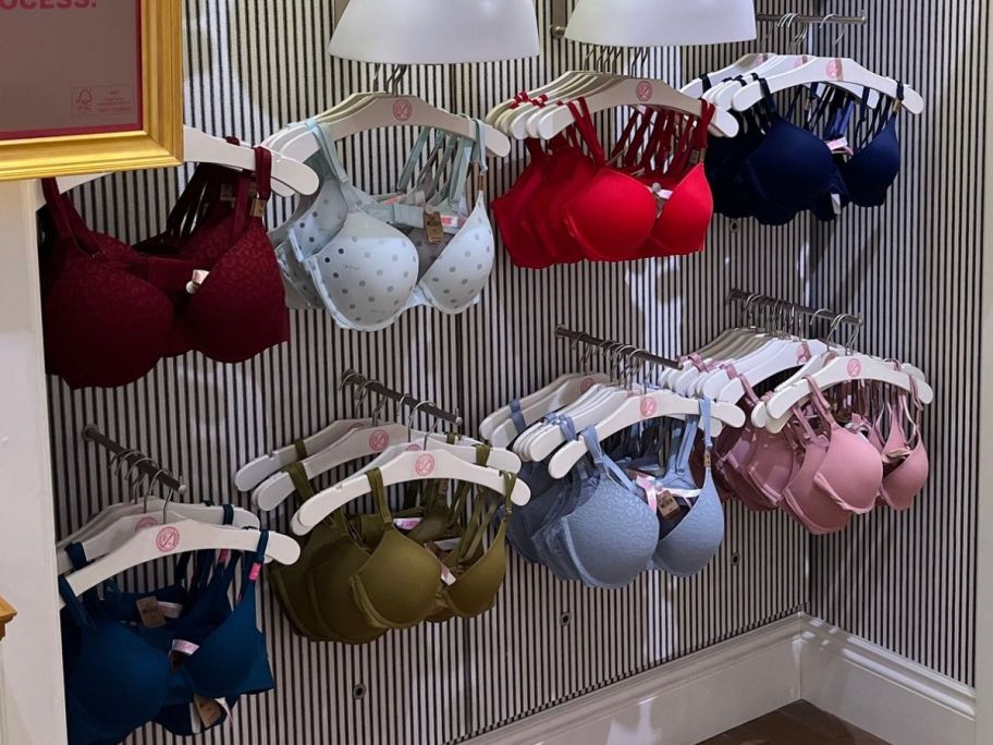 A wall of bras on dosplay at a PINK store