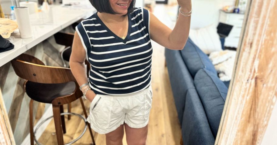 woman wearing Wiholl Women's Cap-Sleeve V-Neck Top in living room